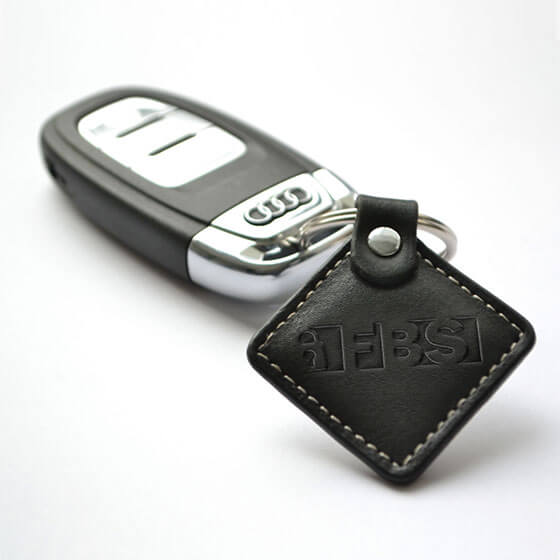 A photo of a key fob with an FBS Invisiprox™ tag on it.