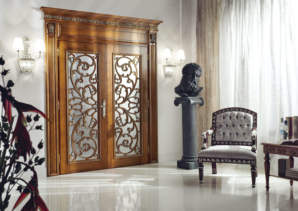 A photo of a set of double bedroom security doors elaborately decorated with real wood and frosted glass.