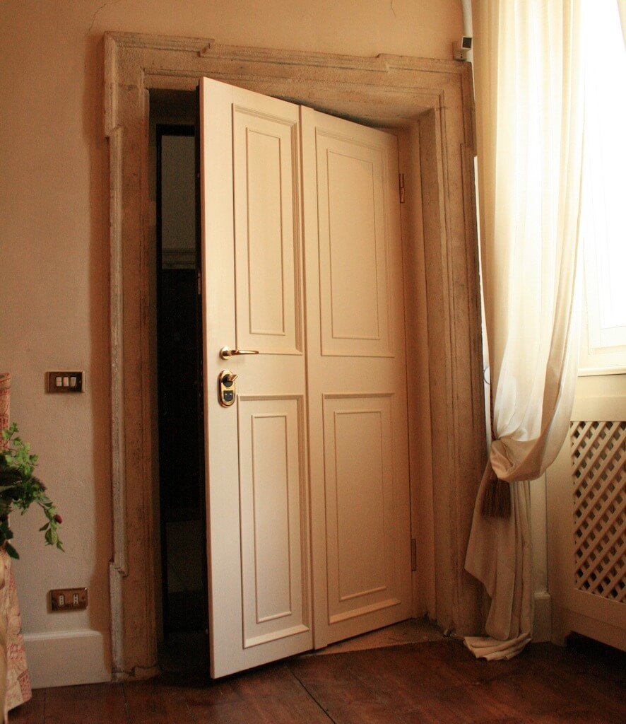 A photo of a custom bedroom security door in a luxury home.