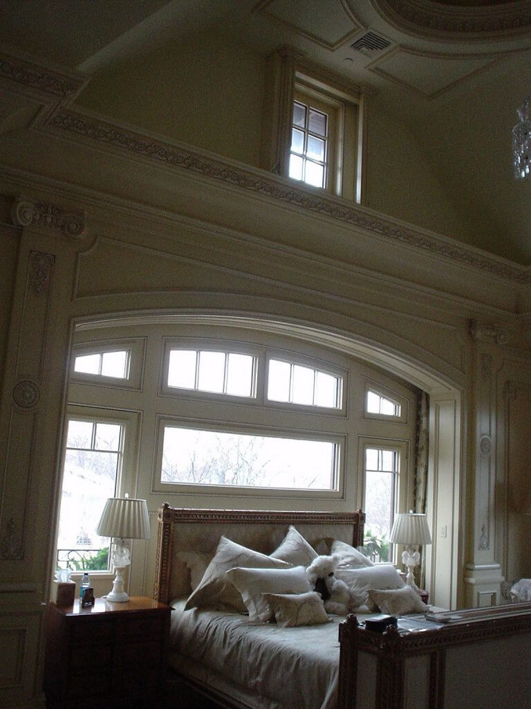 A photo of hurricane windows installed in a luxury home master bedroom.