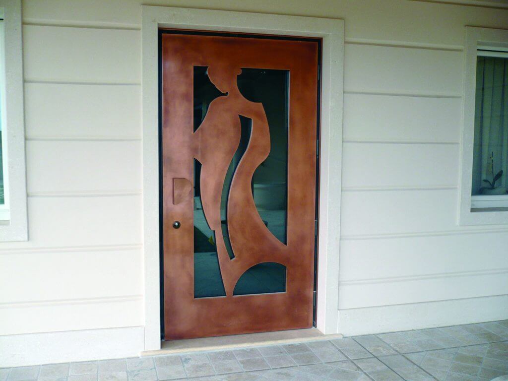 A photo of a custom security door made of wood veneer and glass on a luxury home.
