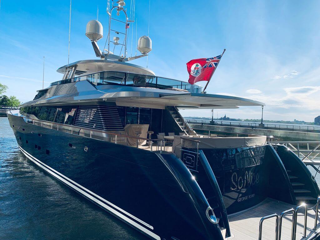 A photo of the back of a luxury yacht in the water.