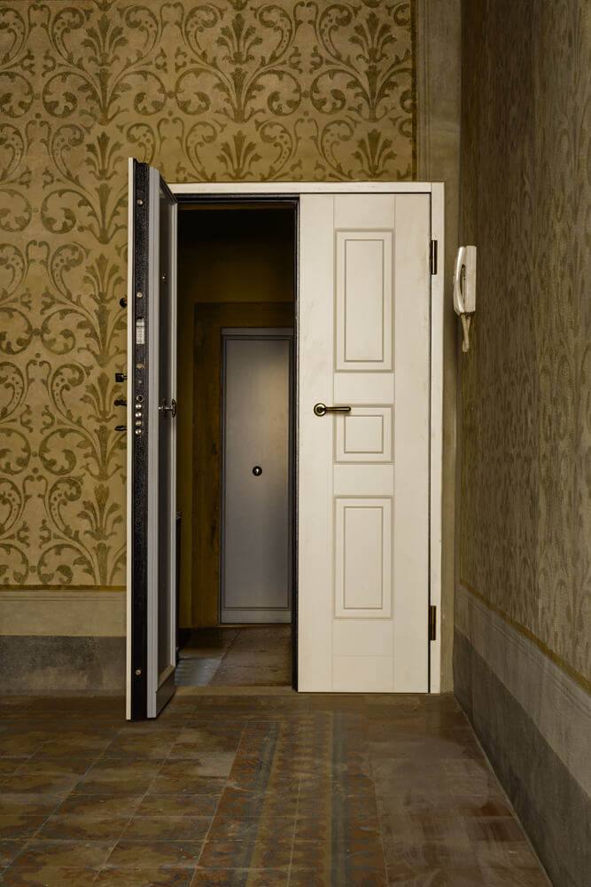 A photo of double doors leading to a master bedroom suite serving as a panic room.