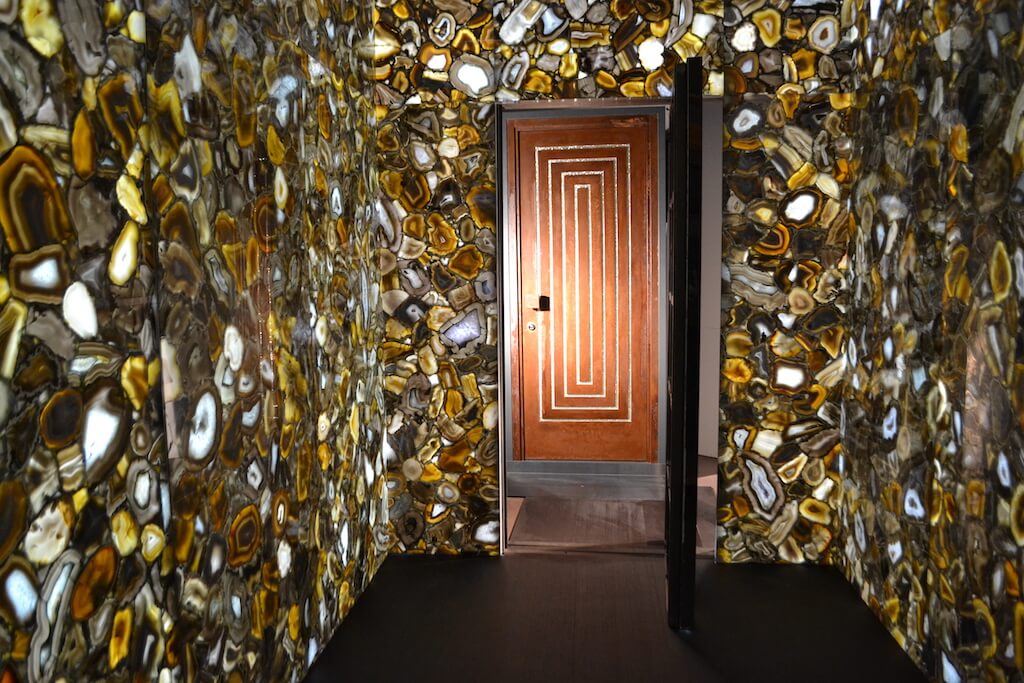A photo of a very elaborate safe room entrance, complete with a custom security door.