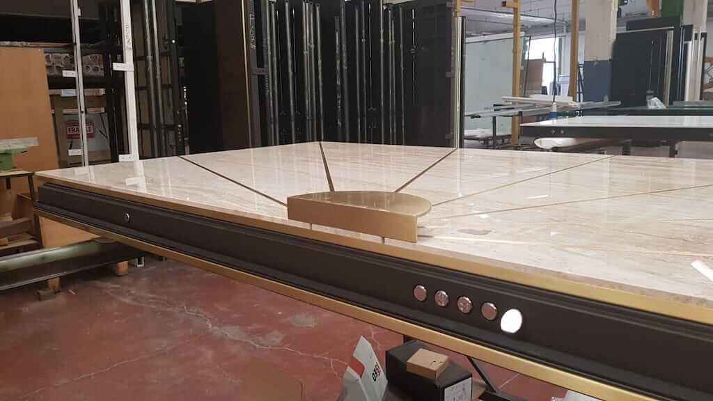 A photo of a custom security door that is in the finishing stages of production.