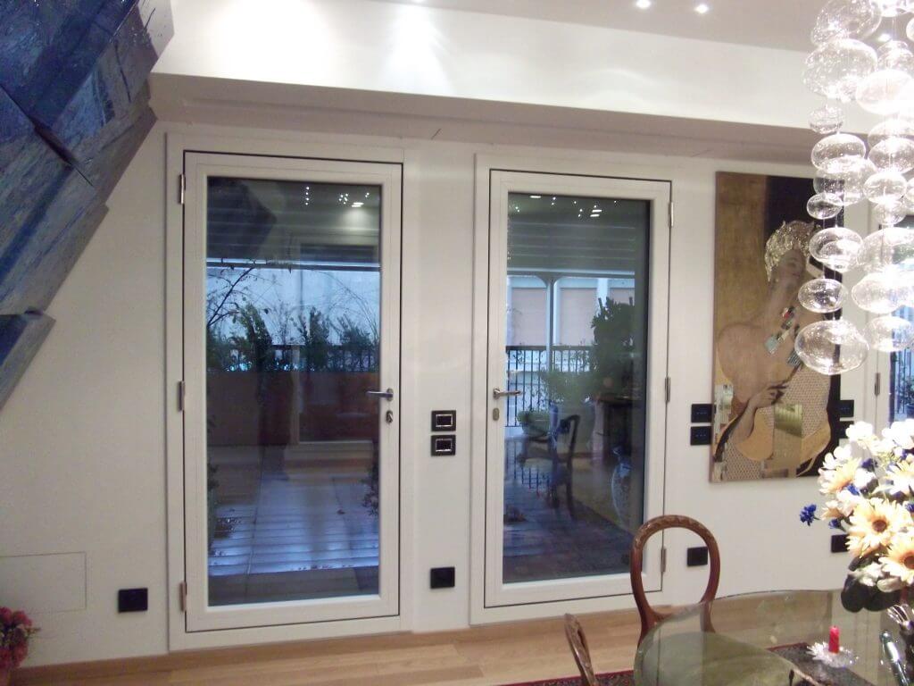 A photo of two glass security doors leading out to a patio.