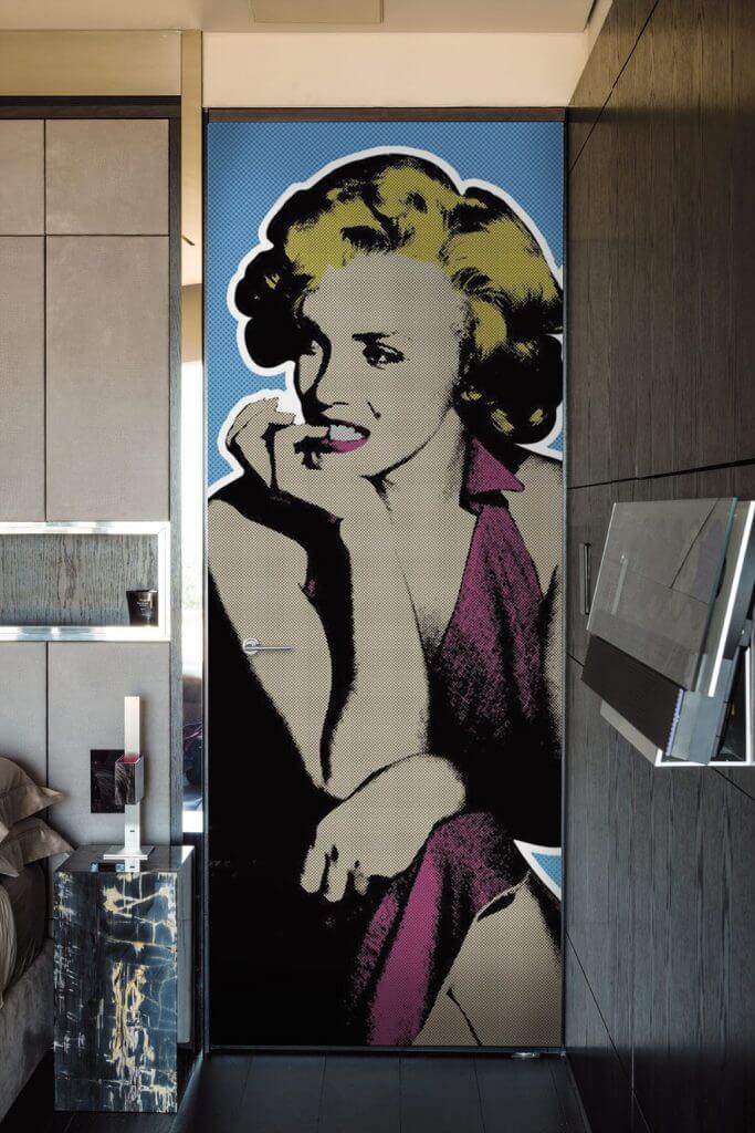 A photo of a bedroom security door designed to feature a portrait of Marilyn Monroe.