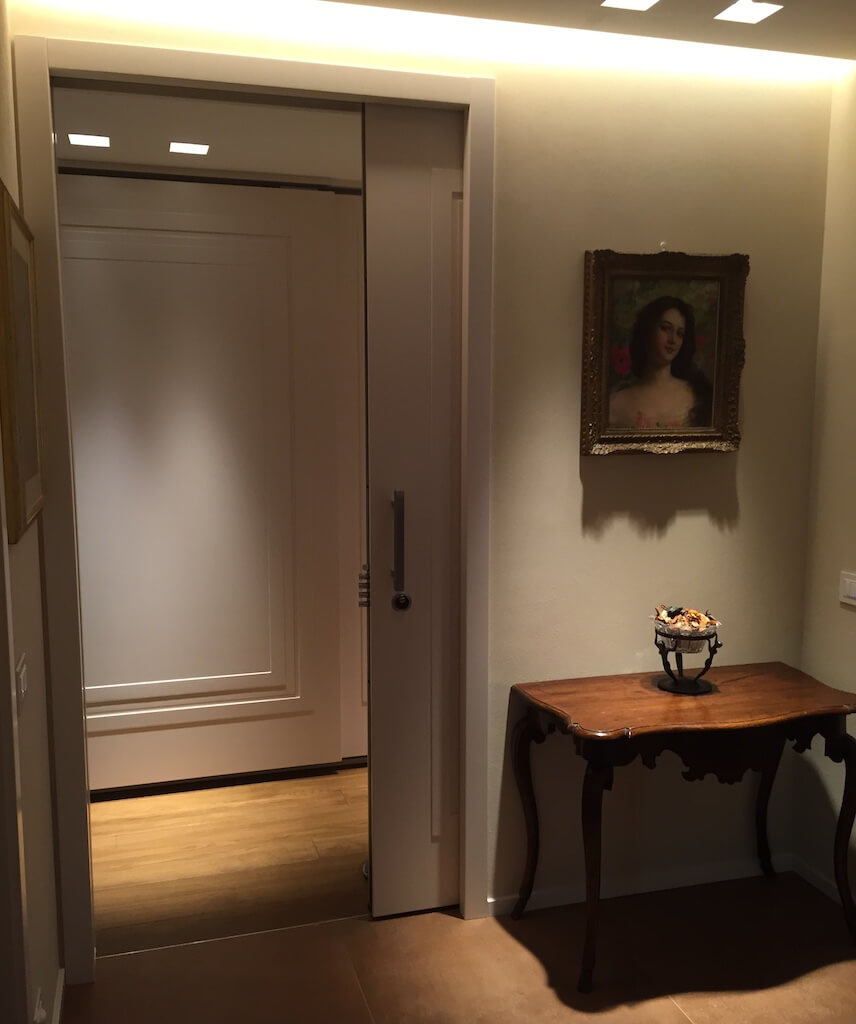A photo of a pocket security door leading to a private room.