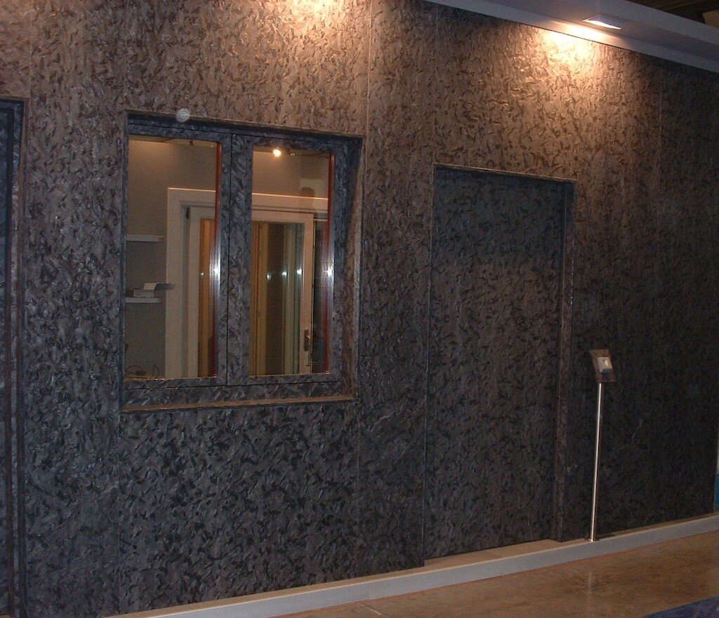 A photo of an indoor storefront featuring a custom security frameless door.